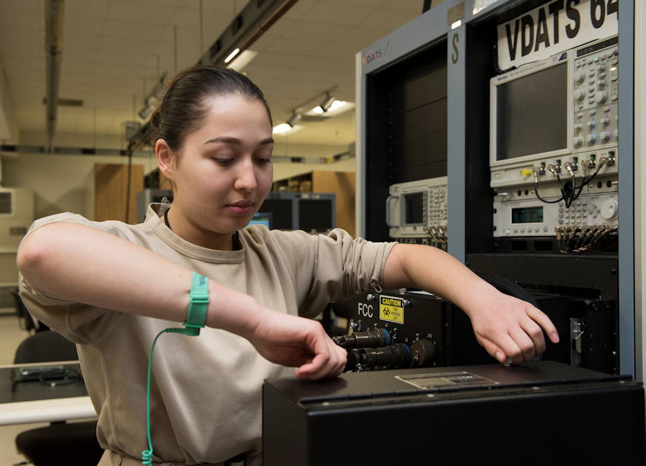 Airman 1st Class Vera Schwenk, an avionics technician assigned to the 509th Maintenance Squadron, removes a panel from a part of the Versatile Diagnostics Automatic Test Station on January 25, 2019 at Whiteman Air Force Base, Mo. Schwenk tests all electrical components of the B-2 Spirit using the VDAT. (U.S. Air Force photo by Staff Sgt. Kayla White)