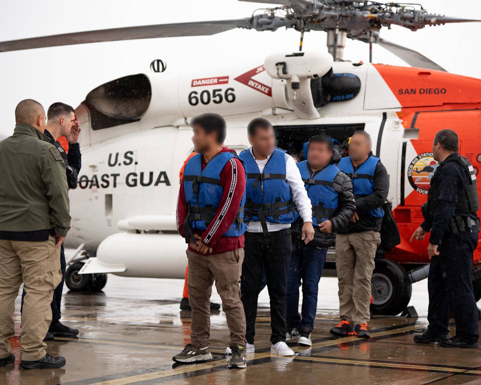 March 11, 2025 - Aliens disembark a U.S. Coast Guard Jayhawk MH-60 helicopter at Sector San Diego after being rescued by hoisting them to the helicopter from their disabled vessel 60 miles southwest of San Diego, California. The 15 aliens were then transferred to waiting Customs and Border Protection agents for custody. (Image created by USA Patriotism! from U.S. Coast Guard photo by Petty Officer 3rd Class Christopher Sappey.)