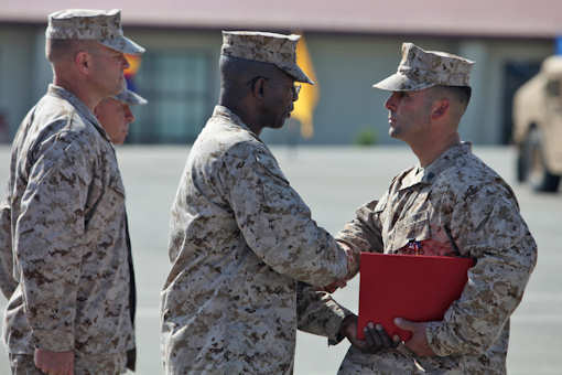 Sgt. Ryan T. Sotelo, Battalion Landing Team 3/5, 15th Marine Expeditionary Unit, shakes hands with Maj. Gen. Ronald L. Bailey, commanding general, 1st Marine Division, after receiving the Silver Star at San Mateo, Calif., March 30, 2012. Sotelo received the United States’ third highest award for combat valor for actions he took as a squad leader with Kilo Company, 3rd Battalion, 5th Marine Regiment while deployed to Sangin District, Afghanistan. Photo by USMC Lance Cpl. Timothy Childers