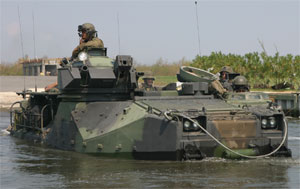 ST. BERNARD PARISH, La. (Sept. 10, 2005) - An Assault Amphibian Vehicle from 4th Assault Amphibian Battalion enters a canal via a boat launch. In order to reach a remote community in St. Bernard Parish that had not been searched yet, the amtracs traveled down four miles of a canal.  Photo by: Cpl. Rocco DeFilippis