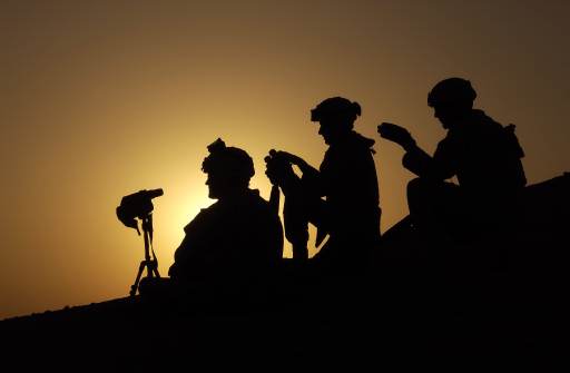 Click to close this view U.S. Army Soldiers with Charlie Company, 4th Battalion, 14th Cavalry, 2nd Platoon, Fort Wainwright, Alaska, provide an over watch while Army and Marines use force to look for weapons cache and people that oppose the coalition forces east of the Syrian boarder by the Euphrates River Oct. 2, 2005.