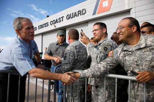 President George W. Bush shakes hands of military personnel outside the emergency operations center at the U.S. Coast Guard Hangar at Ellington Field in Houston Tuesday, Sept. 16, 2008, during his visit to Texas to see firsthand the destruction left in the wake of last weekend's Hurricane Ike.